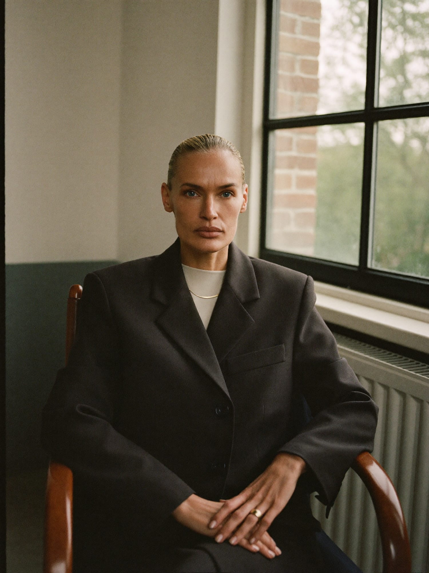 Evelyn Roca, founder of Happy Home, seated by a window
